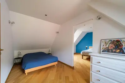 Un ou plusieurs lits dans un hébergement de l'établissement Gîte du Rempart - LA MAISON