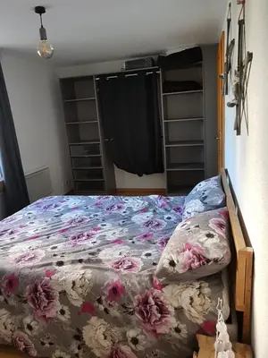 Un ou plusieurs lits dans un hébergement de l'établissement Appartement Melou rez de chaussée