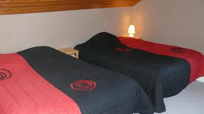 Un ou plusieurs lits dans un hébergement de l'établissement Chalet de la Roche Gauthier