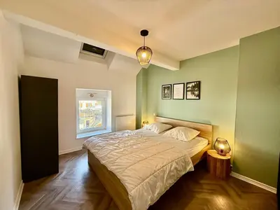 Un ou plusieurs lits dans un hébergement de l'établissement L'Appart des Copains, beau duplex & centre-ville