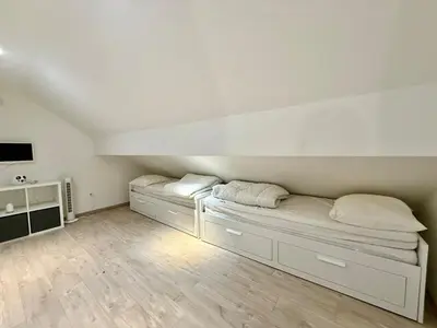 Un ou plusieurs lits dans un hébergement de l'établissement L'Appart des Copains, beau duplex & centre-ville