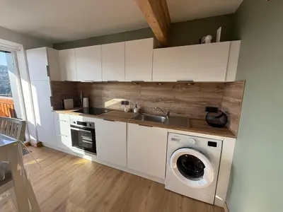 Cuisine ou kitchenette dans l'établissement Appartement avec vue lac