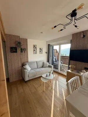 Télévision ou salle de divertissement dans l'établissement Appartement avec vue lac