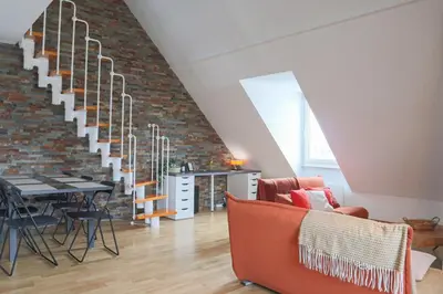 Coin salon dans l'établissement LE DUPLEX BORDERLINE , balade au bord du Rhin
