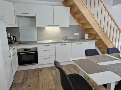 Cuisine ou kitchenette dans l'établissement Appartement rénové Au Rain Grébatte avec terrasse