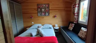 Un ou plusieurs lits dans un hébergement de l'établissement Le petit chalet des Vosges proche Gerardmer