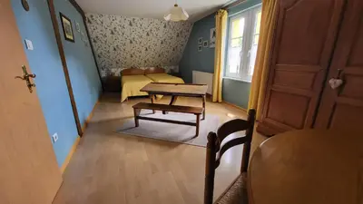 Coin salon dans l'établissement Gîte des Pinsons