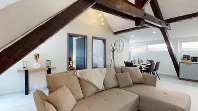 Coin salon dans l'établissement Le Big Bag 5 chambres appartement familial