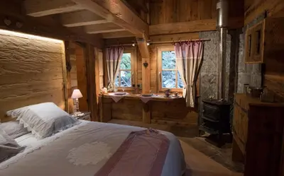 Un ou plusieurs lits dans un hébergement de l'établissement Amour de Chalet - Clairière aux cabanes - Bol d'air