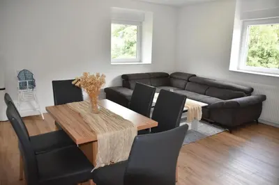 Coin salon dans l'établissement Renovated cottages 2