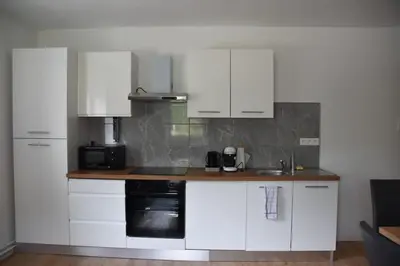 Cuisine ou kitchenette dans l'établissement Renovated cottages 2