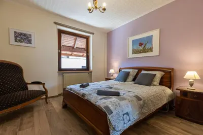 Un ou plusieurs lits dans un hébergement de l'établissement Appartement Denise - base idéale pour explorer l'Alsace, emplacement privilégié entre vignes et Vosges