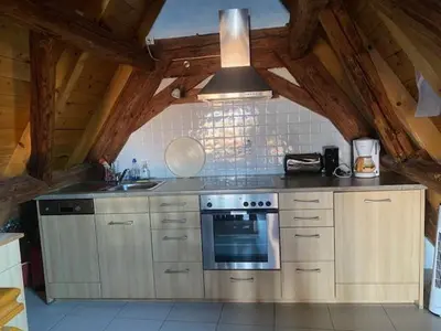 Cuisine ou kitchenette dans l'établissement L'Insolite