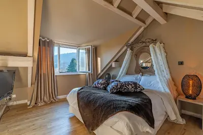 Un ou plusieurs lits dans un hébergement de l'établissement Le B Cottage & SPA Privé