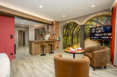 Coin salon dans l'établissement Le 16-Appart'Hôtel-GregIMMO