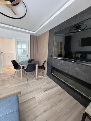 Coin salon dans l'établissement Très bel appartement PremiumSteinbach-parking