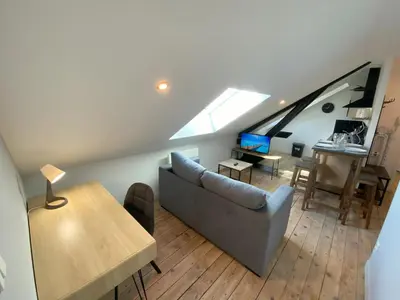 Coin salon dans l'établissement Logement Neuf Cosy avec Espaces Communs Premium 22