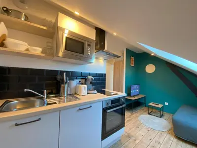 Cuisine ou kitchenette dans l'établissement Logement Neuf Cosy avec Espaces Communs Premium 21