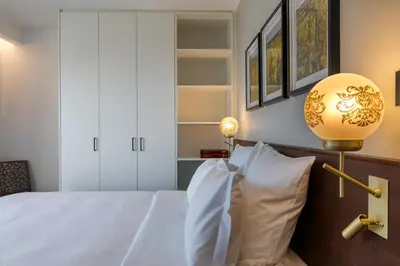 Un ou plusieurs lits dans un hébergement de l'établissement Les Appartements Husseren Collections - Proche Colmar - Eguisheim