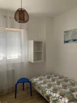 Un ou plusieurs lits dans un hébergement de l'établissement Maison Martin de ville de style 6 pers calme terrasse