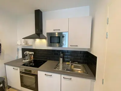 Cuisine ou kitchenette dans l'établissement Logement Neuf Cosy avec Espaces Communs Premium 04