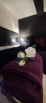 Un ou plusieurs lits dans un hébergement de l'établissement Loveroom Chambre obscure