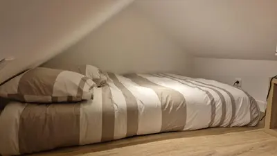 Un ou plusieurs lits dans un hébergement de l'établissement 2 logements Neuf Cosy avec Espaces Communs Premium Espace détente 23-24
