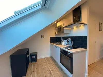 Cuisine ou kitchenette dans l'établissement 2 logements Neuf Cosy avec Espaces Communs Premium Espace détente 21-22