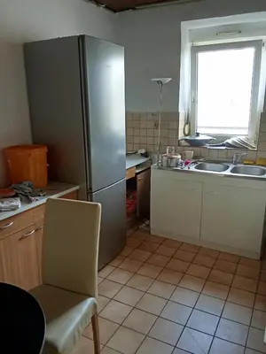 Cuisine ou kitchenette dans l'établissement Chambre dans une appartement
