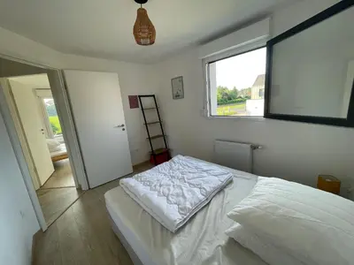 Un ou plusieurs lits dans un hébergement de l'établissement Maisons neuves dans quartier calme
