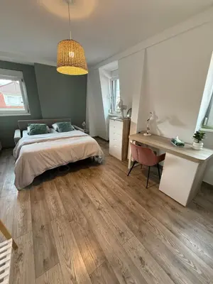 Un ou plusieurs lits dans un hébergement de l'établissement Maison familiale avec piscine privative