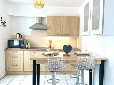 Cuisine ou kitchenette dans l'établissement Gîte Le 25