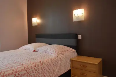 Un ou plusieurs lits dans un hébergement de l'établissement Appartement Timgad