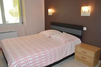 Un ou plusieurs lits dans un hébergement de l'établissement Appartement Timgad