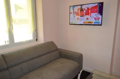 Coin salon dans l'établissement Appartement Timgad