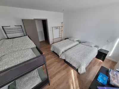 Un ou plusieurs lits dans un hébergement de l'établissement COLMAR Appartement 6 personnes parking privé JAB'S HOME 2