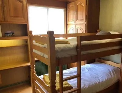 Un ou plusieurs lits dans un hébergement de l'établissement Le Repère du Bien-être - Maison 5 chambres, Sauna, Cinéma