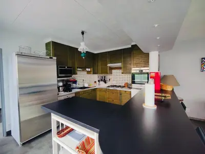 Cuisine ou kitchenette dans l'établissement Le Repère du Bien-être - Maison 5 chambres, Sauna, Cinéma