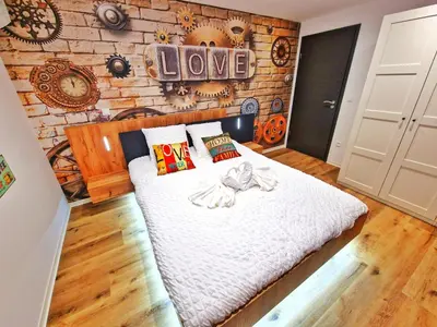 Un ou plusieurs lits dans un hébergement de l'établissement LOFT & SPA-6 Pers-Jacuzzi-Parking-Jardin-Clim-Colmar