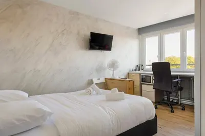 Un ou plusieurs lits dans un hébergement de l'établissement WilSix by Max, Renovated, bright studio, 1 min from train station