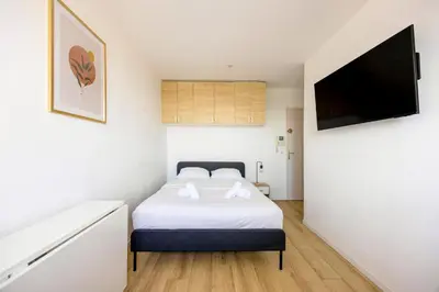 Un ou plusieurs lits dans un hébergement de l'établissement WilSeize by Max, Bright, renovated studio, 1 min station