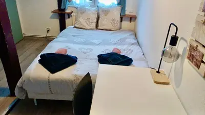 Un ou plusieurs lits dans un hébergement de l'établissement Le Nid du Veilleur-10min de Colmar