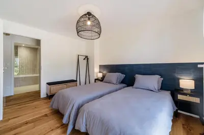 Un ou plusieurs lits dans un hébergement de l'établissement Duplex Jardin – Gîte des 4 Lions