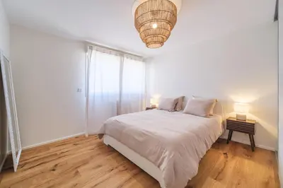 Un ou plusieurs lits dans un hébergement de l'établissement Duplex Jardin – Gîte des 4 Lions