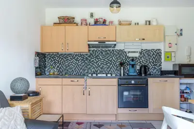 Cuisine ou kitchenette dans l'établissement Résidence Le Printemps - Appt vue montagne