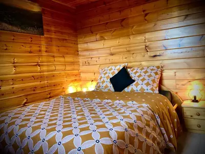 Un ou plusieurs lits dans un hébergement de l'établissement Le chalet du Hibou