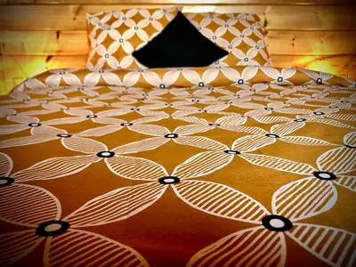 Un ou plusieurs lits dans un hébergement de l'établissement Le chalet du Hibou