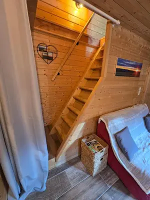 Un ou plusieurs lits dans un hébergement de l'établissement Gîte Haut Les Cœurs - Chalet dans les Hautes-Vosges