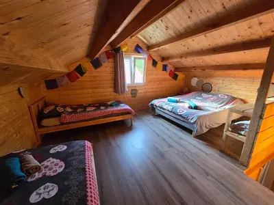 Un ou plusieurs lits dans un hébergement de l'établissement Gîte Haut Les Cœurs - Chalet dans les Hautes-Vosges