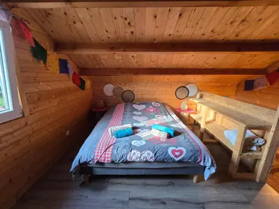 Un ou plusieurs lits dans un hébergement de l'établissement Gîte Haut Les Cœurs - Chalet dans les Hautes-Vosges